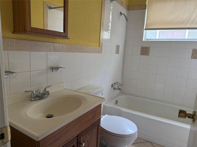 2608 N Hickory St, Sherman, TX 75092 - bathroom featuring shower / bath combination, vanity, tile walls, a textured wall, and backsplash