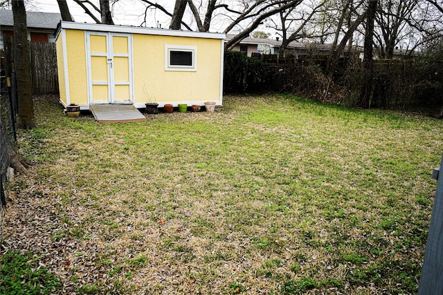 2608 N Hickory St, Sherman, TX 75092 - fenced backyard featuring a storage unit