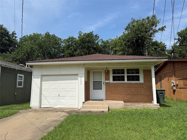 2608 N Hickory St, Sherman, TX 75092 - ranch-style house featuring concrete driveway, brick siding, an attached garage, and a front lawn