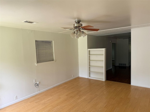 2608 N Hickory St, Sherman, TX 75092 - empty room with a ceiling fan, wood finished floors, and built in features