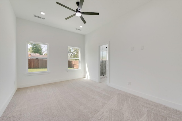 4515 Eutopia St, Greenville, TX 75401 - empty room featuring light colored carpet, ceiling fan, and visible vents