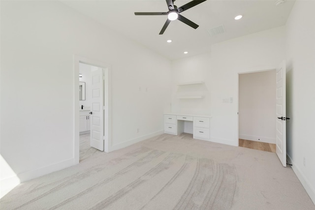 4515 Eutopia St, Greenville, TX 75401 - unfurnished bedroom featuring light colored carpet, ensuite bath, visible vents, recessed lighting, and baseboards