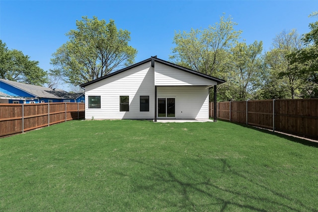 4515 Eutopia St, Greenville, TX 75401 - back of house with a fenced backyard, a patio, and a yard