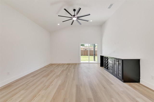4515 Eutopia St, Greenville, TX 75401 - unfurnished living room with a ceiling fan, light wood-type flooring, visible vents, baseboards, and a dry bar