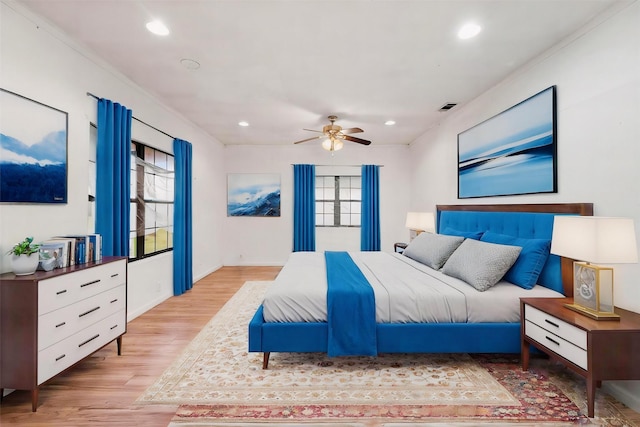 bedroom featuring ceiling fan, wood finished floors, visible vents, and recessed lighting