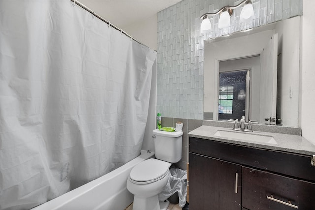 bathroom with tile walls, shower / tub combo with curtain, vanity, and toilet