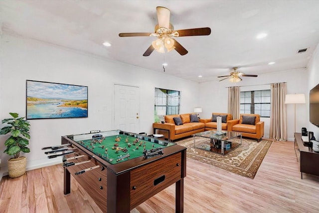 game room with recessed lighting, light wood-style floors, a ceiling fan, and baseboards