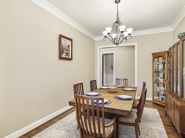 741 Butchart Dr, Prosper, TX 75078 - dining area with a chandelier, dark wood-style floors, crown molding, and baseboards