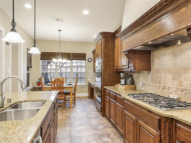 741 Butchart Dr, Prosper, TX 75078 - kitchen with stainless steel appliances, custom exhaust hood, a sink, a chandelier, and decorative backsplash