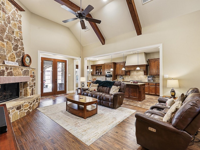 741 Butchart Dr, Prosper, TX 75078 - living area featuring a ceiling fan, beam ceiling, high vaulted ceiling, french doors, and a fireplace