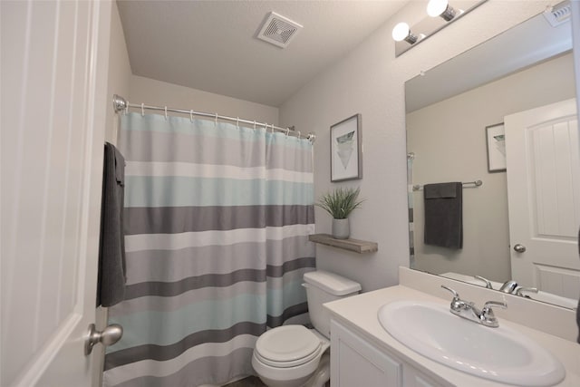 bathroom with visible vents, curtained shower, toilet, and vanity