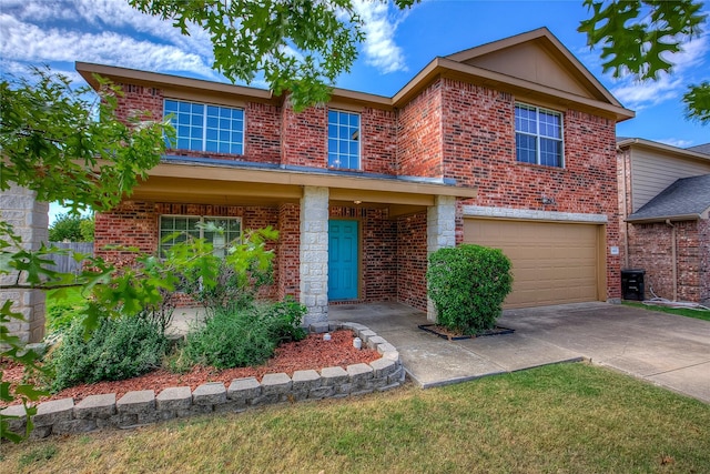 traditional home featuring brick siding, driveway, and a garage