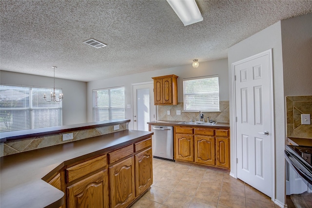 kitchen featuring black electric range oven, a sink, stainless steel dishwasher, and brown cabinets