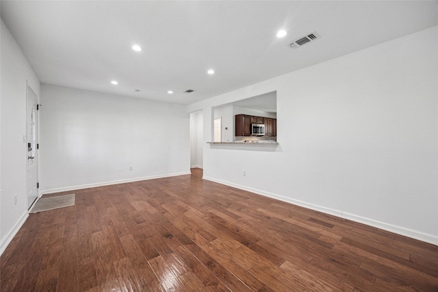 5609 Fursman Ave, Fort Worth, TX 76114 - unfurnished living room with dark wood finished floors, recessed lighting, and baseboards