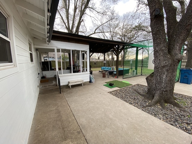 1704 S Houston St, Kaufman, TX 75142 - view of patio / terrace featuring a sunroom and an outdoor hangout area