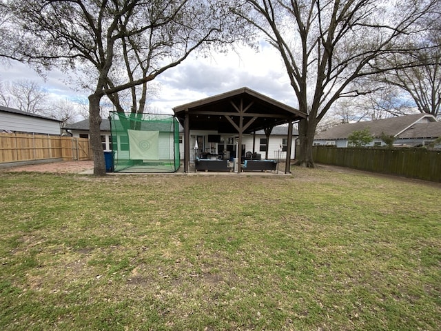 1704 S Houston St, Kaufman, TX 75142 - back of property with a patio and an outdoor hangout area