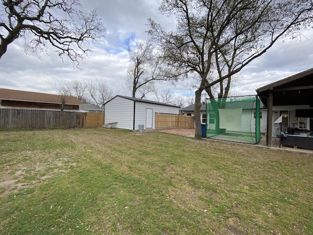 1704 S Houston St, Kaufman, TX 75142 - view of yard featuring an outdoor structure and a patio area