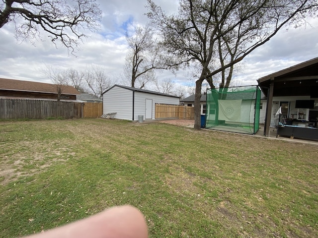 1704 S Houston St, Kaufman, TX 75142 - view of yard featuring an outdoor structure and a patio area