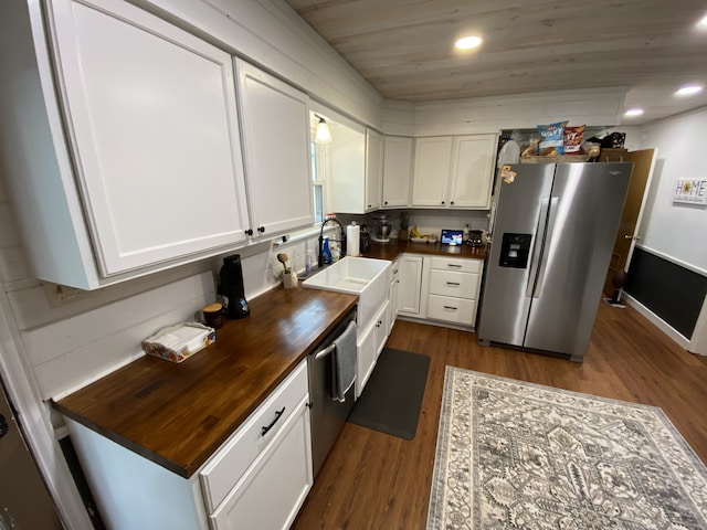 1704 S Houston St, Kaufman, TX 75142 - kitchen with appliances with stainless steel finishes, butcher block counters, a sink, dark wood-style floors, and wooden ceiling