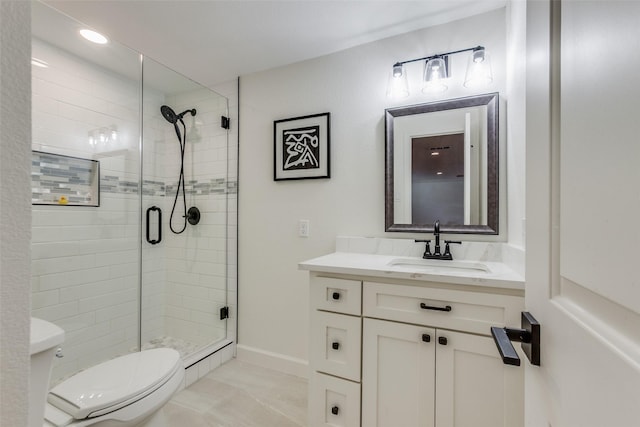full bathroom with toilet, a stall shower, and vanity