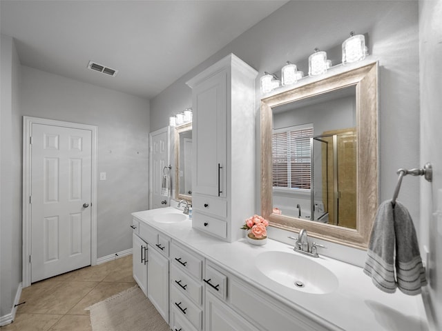 7601 Glenwood Springs Ln, Mckinney, TX 75070 - bathroom with a sink, visible vents, a shower stall, and tile patterned flooring