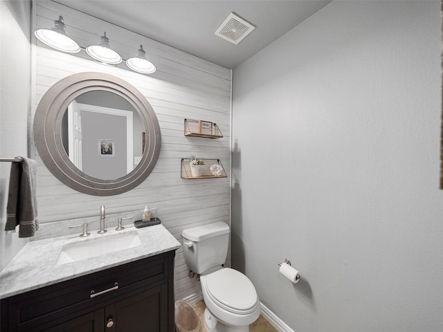 7601 Glenwood Springs Ln, Mckinney, TX 75070 - half bathroom featuring vanity, visible vents, and toilet