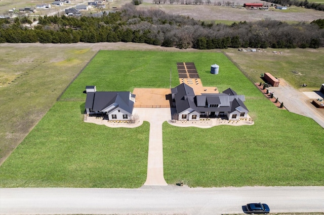 birds eye view of property featuring a rural view