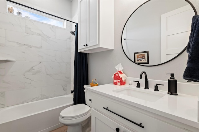 full bathroom featuring vanity, shower / bath combination with curtain, and toilet