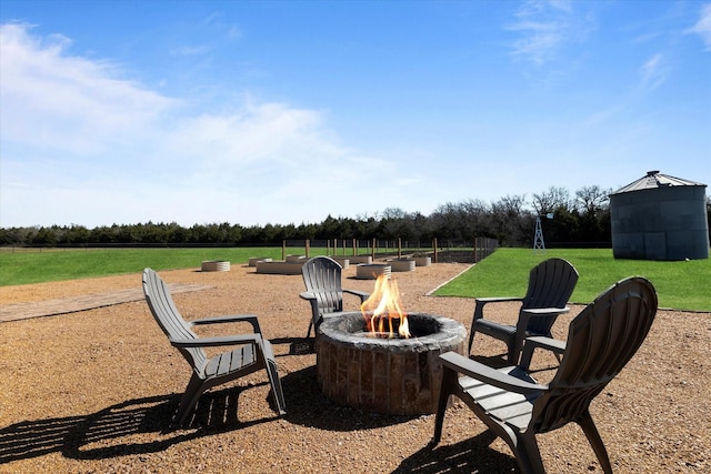 view of yard with an outdoor fire pit