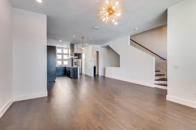 4609 Steel St, Dallas, TX 75219 - unfurnished living room featuring stairway, dark wood-style floors, baseboards, recessed lighting, and a notable chandelier