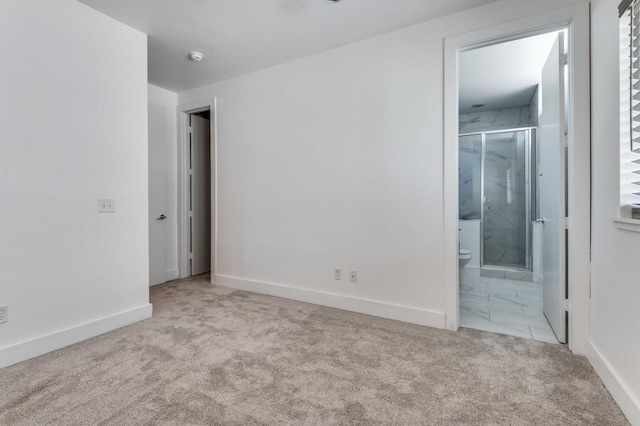 4609 Steel St, Dallas, TX 75219 - unfurnished bedroom with baseboards, ensuite bath, and carpet flooring