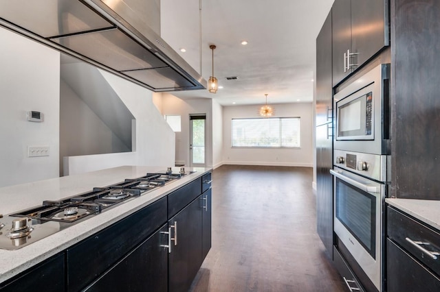 4609 Steel St, Dallas, TX 75219 - kitchen with open floor plan, appliances with stainless steel finishes, dark wood-type flooring, and dark cabinets
