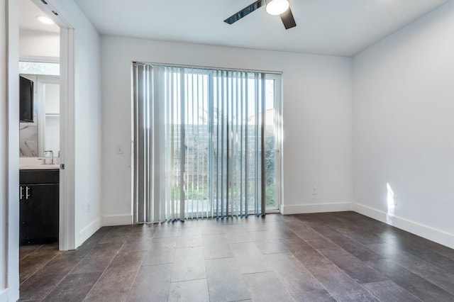 4609 Steel St, Dallas, TX 75219 - empty room with a sink, baseboards, and ceiling fan