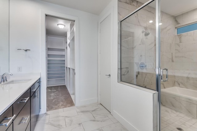 4609 Steel St, Dallas, TX 75219 - full bath featuring vanity, baseboards, a stall shower, a spacious closet, and marble finish floor