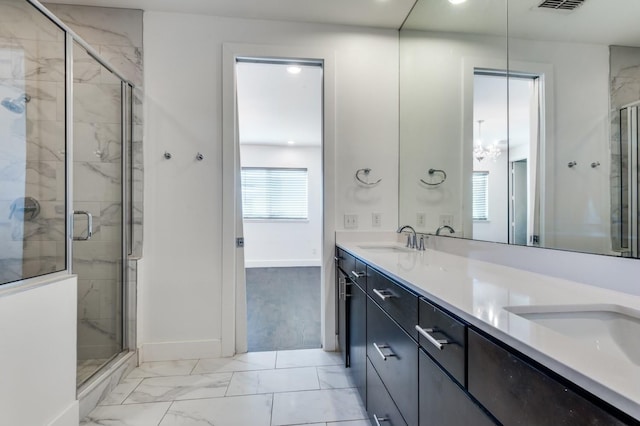 4609 Steel St, Dallas, TX 75219 - full bath featuring marble finish floor, a sink, a shower stall, double vanity, and baseboards