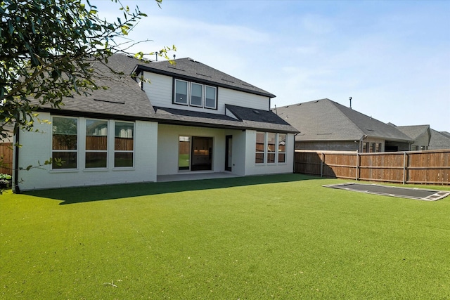 2817 Yarmouth St, Celina, TX 75009 - back of house featuring fence, a shingled roof, a lawn, a patio area, and brick siding