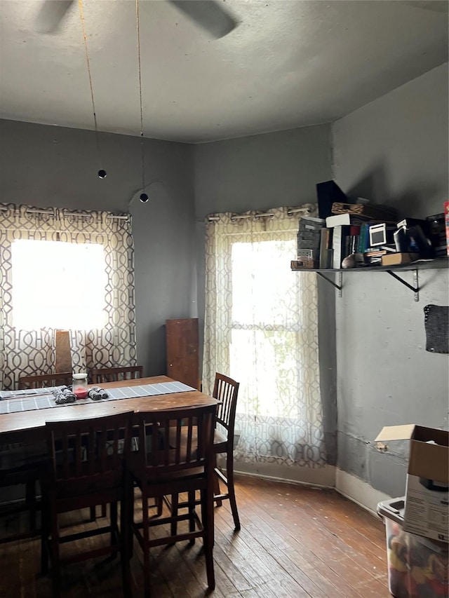 dining area with hardwood / wood-style floors