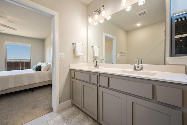 full bathroom featuring tile patterned floors, a ceiling fan, a sink, and connected bathroom