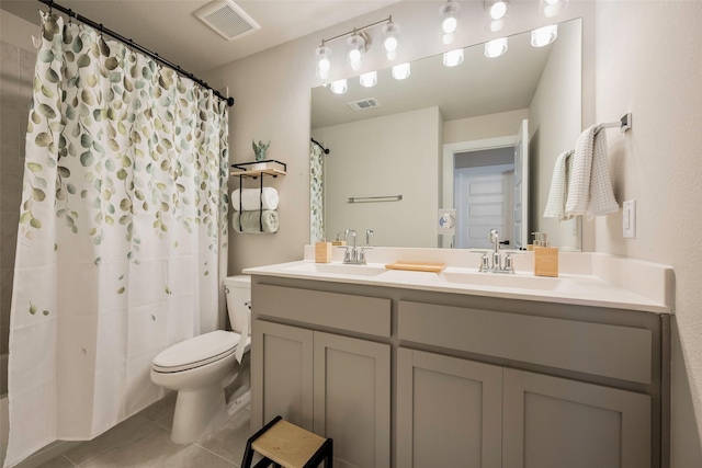 bathroom with visible vents, a sink, and toilet