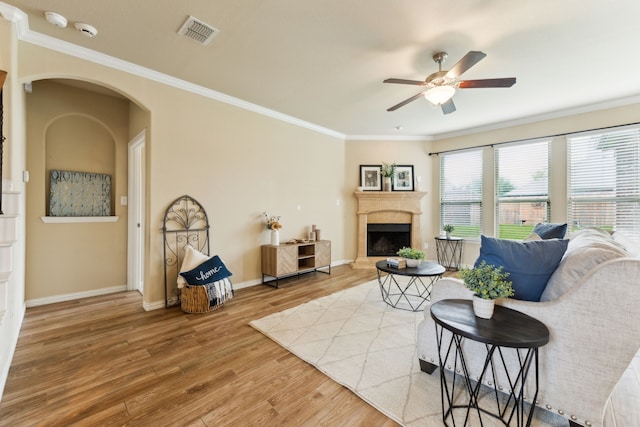 1605 Tahoe Trl, Prosper, TX 75078 - living room with ornamental molding, a ceiling fan, wood finished floors, and visible vents