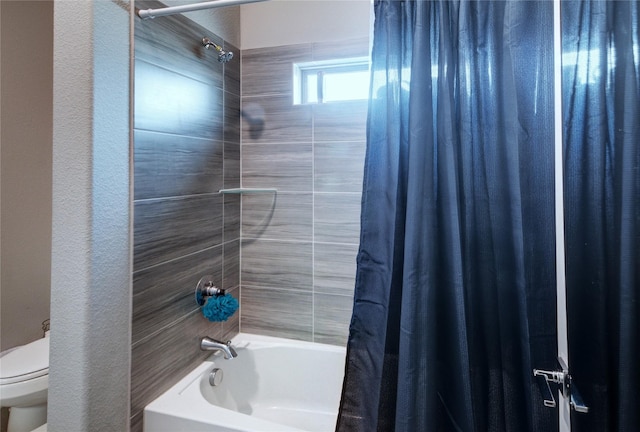 full bath with toilet and shower / bath combo with shower curtain