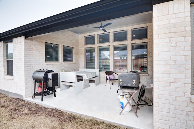 view of patio with grilling area and ceiling fan