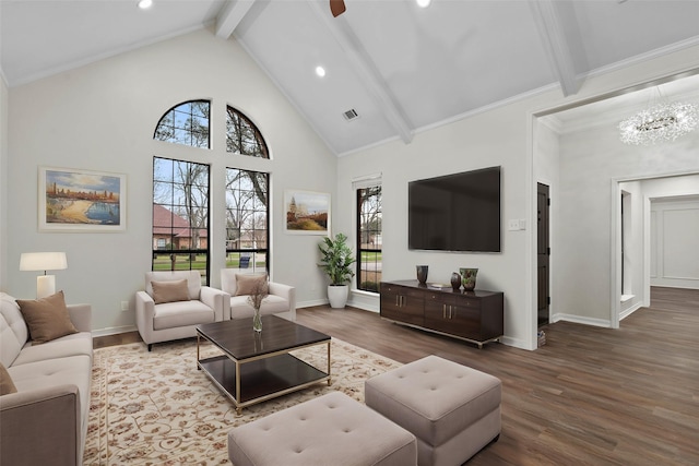 living room featuring a wealth of natural light, wood finished floors, a notable chandelier, and beamed ceiling