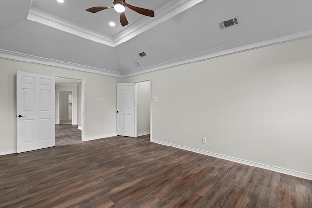 unfurnished bedroom with visible vents, baseboards, a raised ceiling, and dark wood finished floors