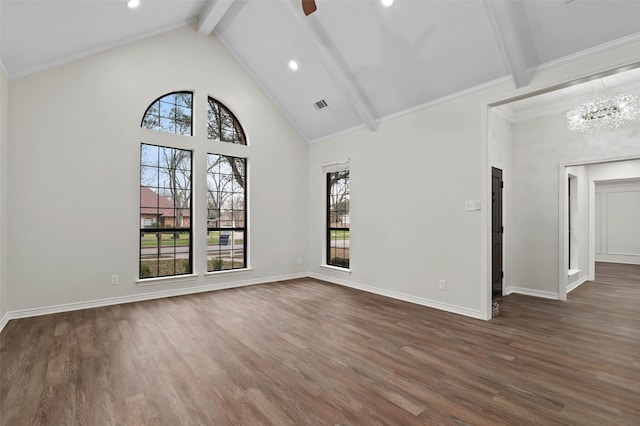 interior space featuring beam ceiling, a healthy amount of sunlight, and dark wood-style floors