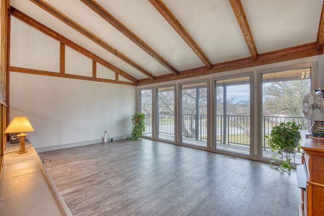 237 Runaway Bay Dr, Runaway Bay, TX 76426 - unfurnished living room with high vaulted ceiling, beam ceiling, and wood finished floors