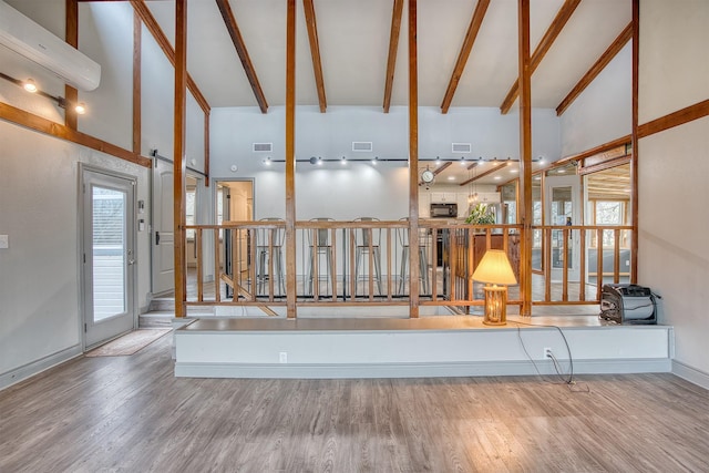237 Runaway Bay Dr, Runaway Bay, TX 76426 - entryway with wood finished floors, a healthy amount of sunlight, lofted ceiling with beams, and visible vents
