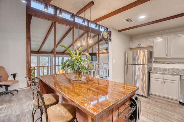 237 Runaway Bay Dr, Runaway Bay, TX 76426 - kitchen featuring wood counters, tasteful backsplash, beamed ceiling, visible vents, and black appliances