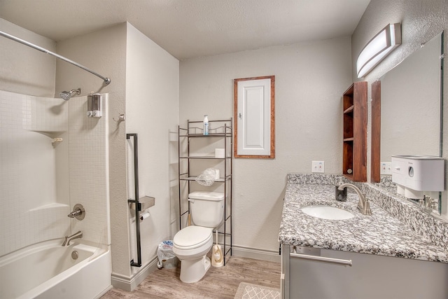 237 Runaway Bay Dr, Runaway Bay, TX 76426 - bathroom with toilet, a textured wall, and vanity