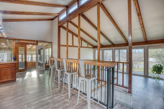 237 Runaway Bay Dr, Runaway Bay, TX 76426 - corridor featuring beamed ceiling, high vaulted ceiling, and wood finished floors